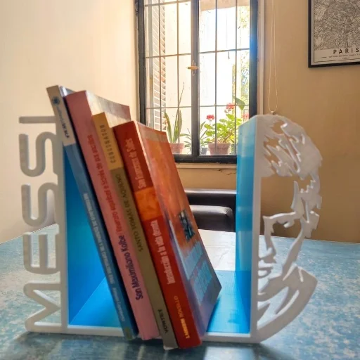 Sujeta libros/video juegos Messi